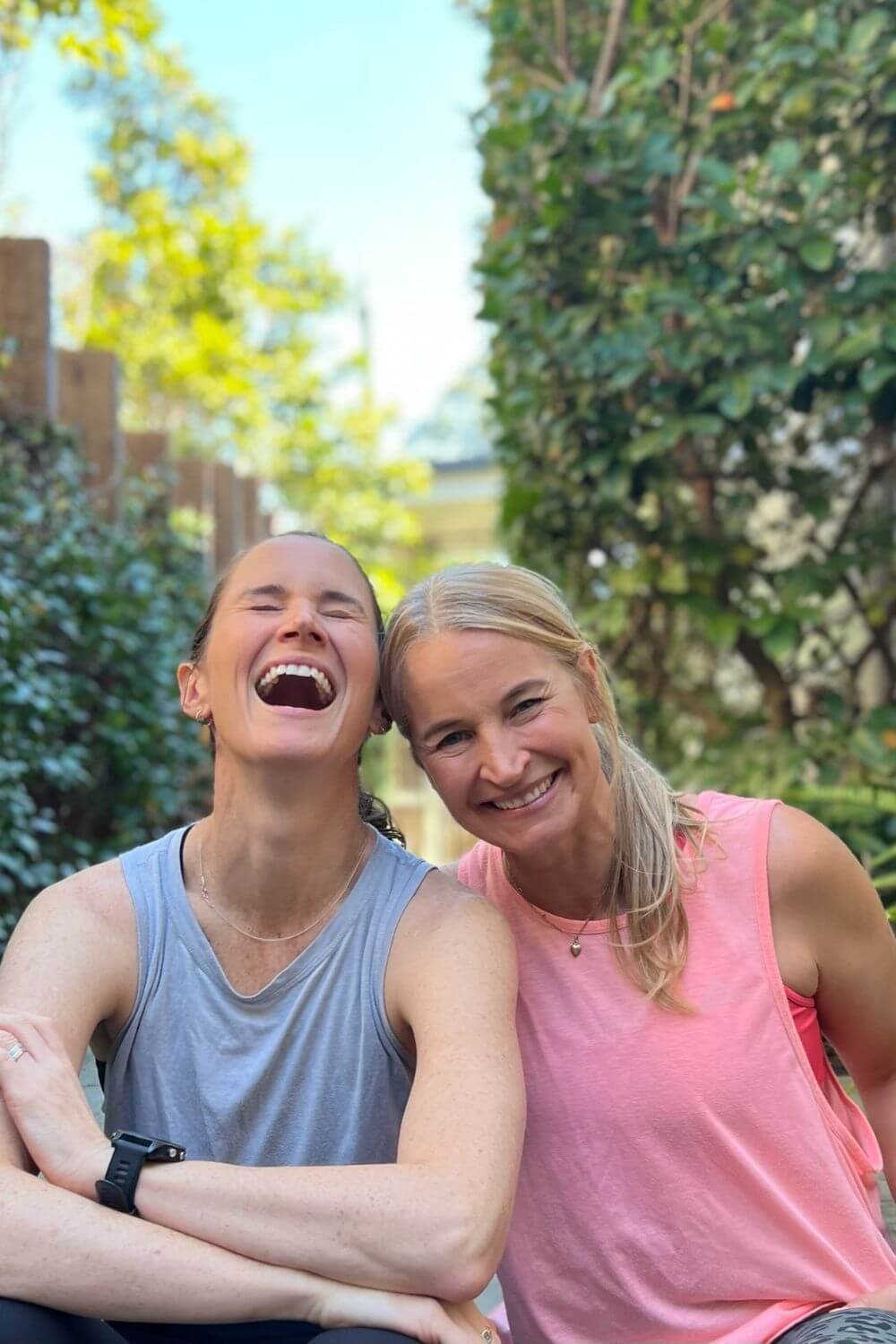 Anna and Em laughing in entranceway