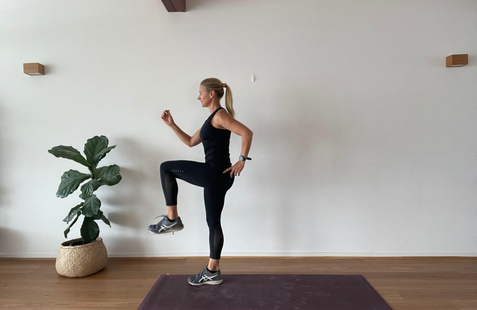 Anna doing high knee lift in studio