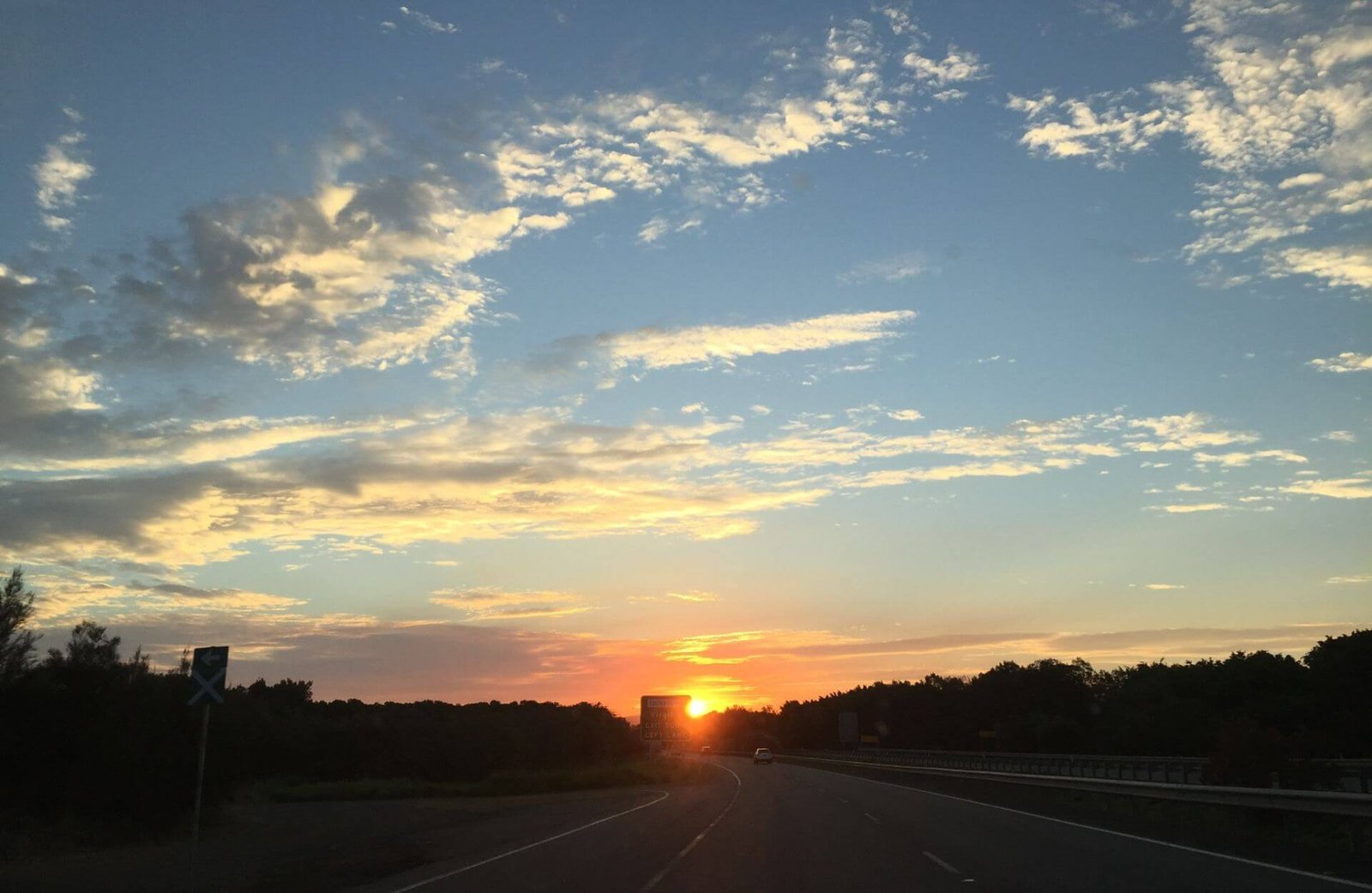 Sunrise at the end of a long road