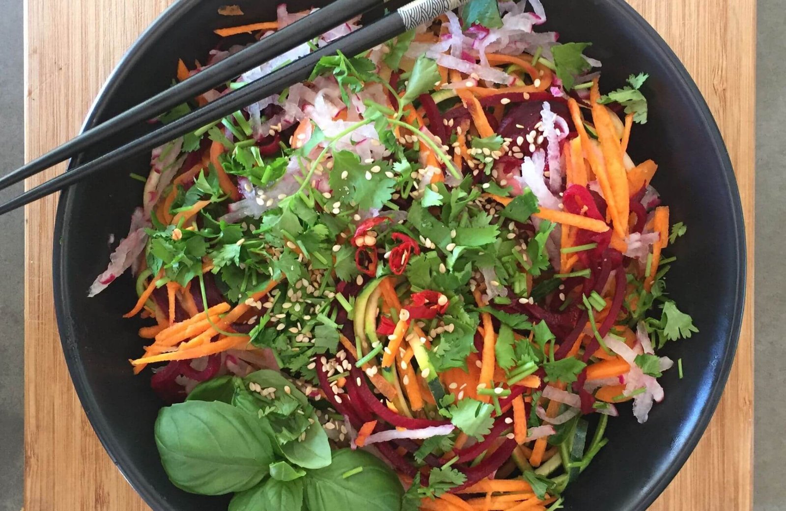 Rainbow chopped salad with sesame seeds and coriander