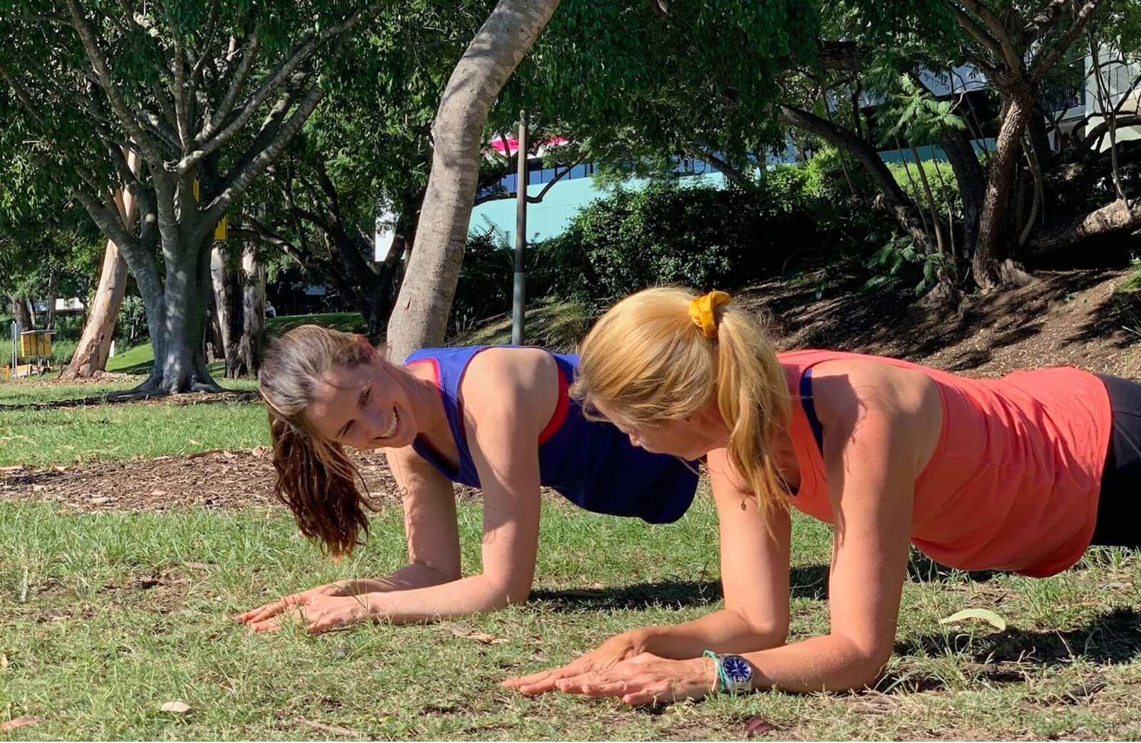 Anna and Em front plank in park