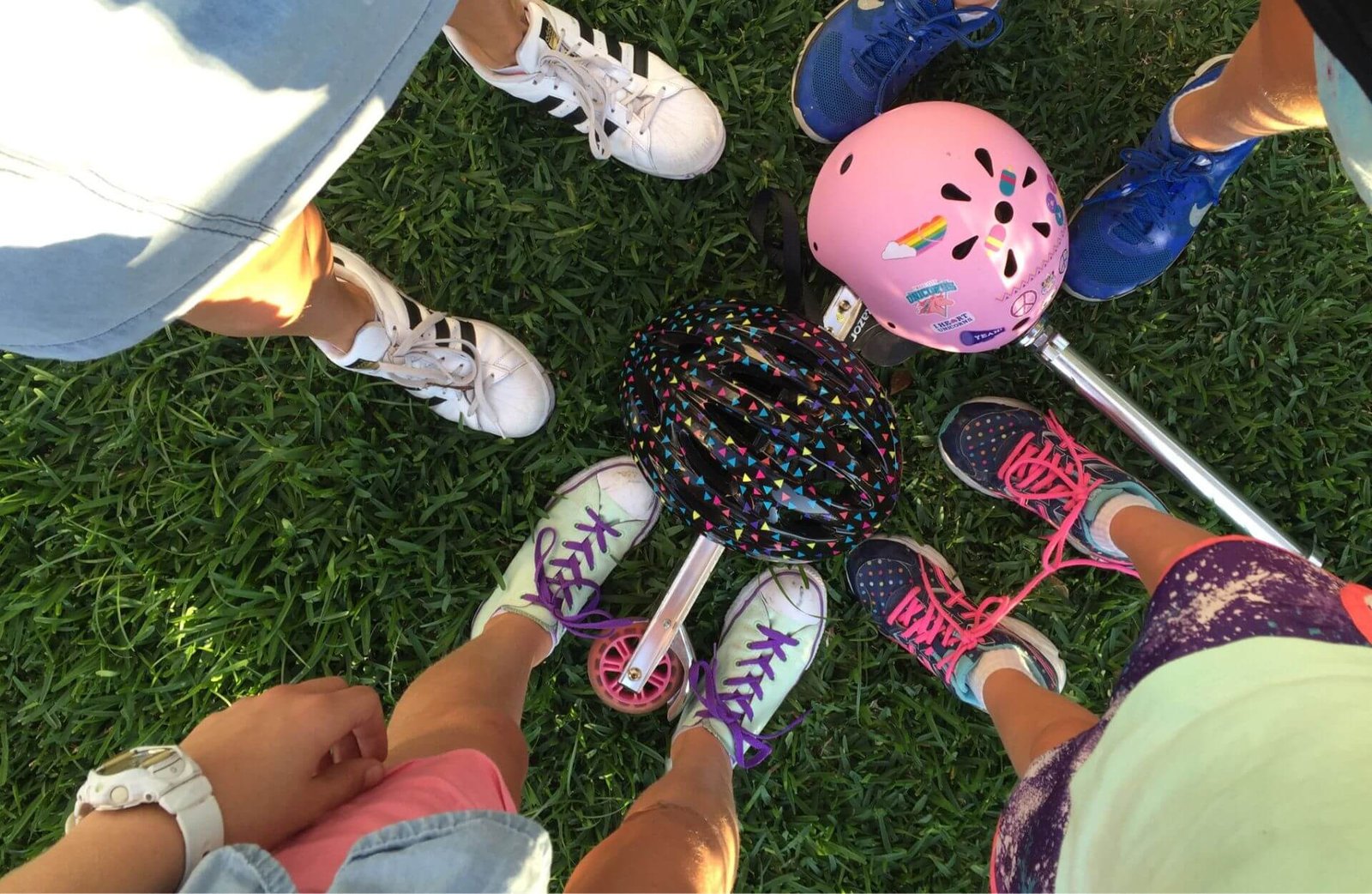 active kids with scooters and helmets