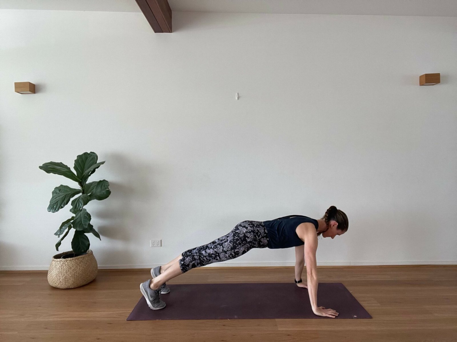 Em in studio doing high plank