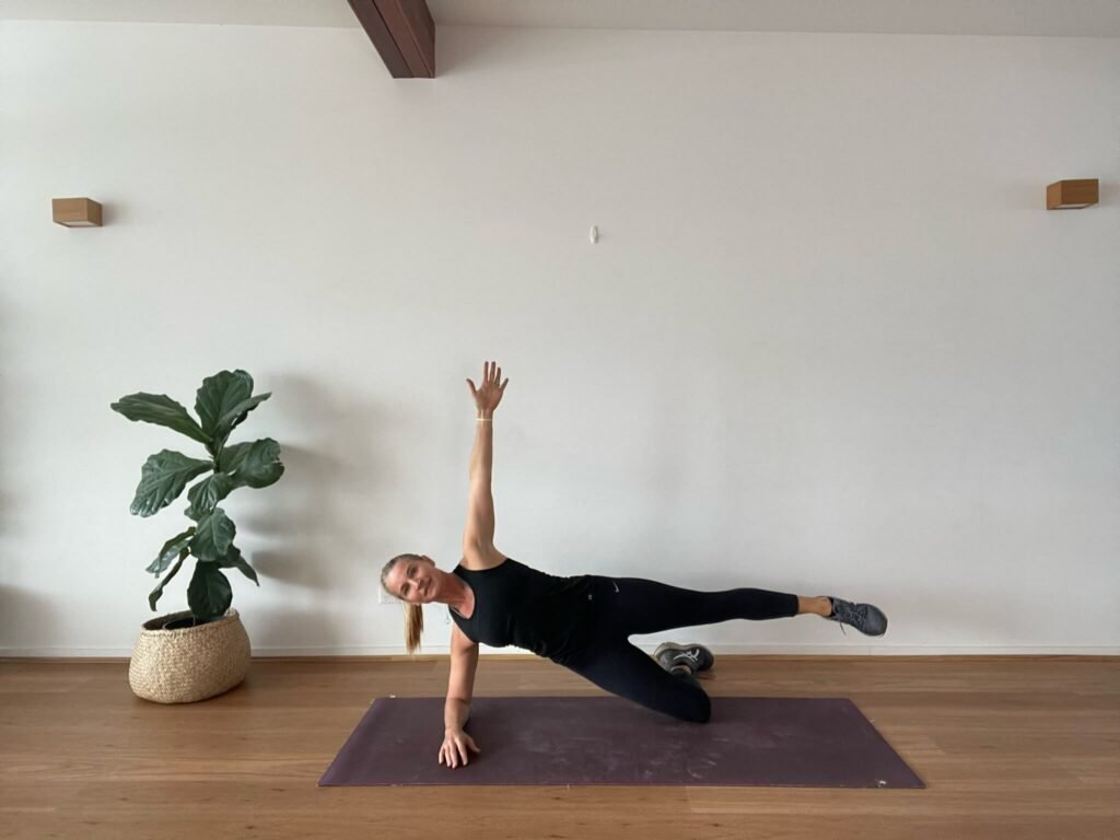 Anna in studio doing side plank