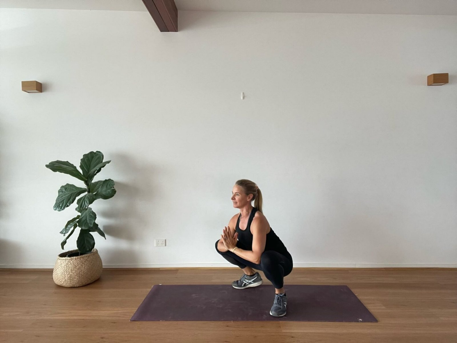 Anna in studio in buddah squat