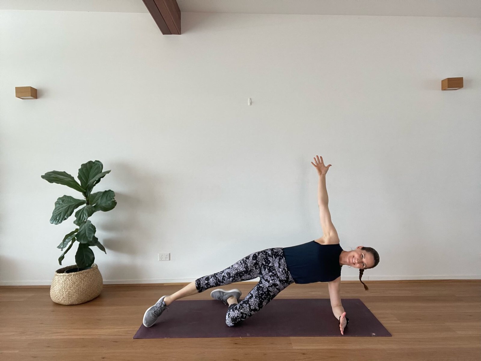 Em in studio in side plank
